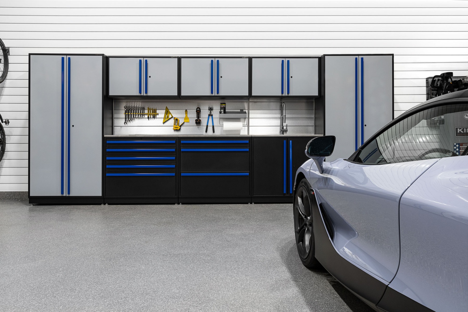 Proslat gray and blue garage cabinet installation