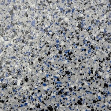 Midnight Blue - "Midnight Blue polyaspartic flooring featuring deep blue tones with subtle black flecks, providing a sleek and modern look that adds a touch of sophistication to your garage."